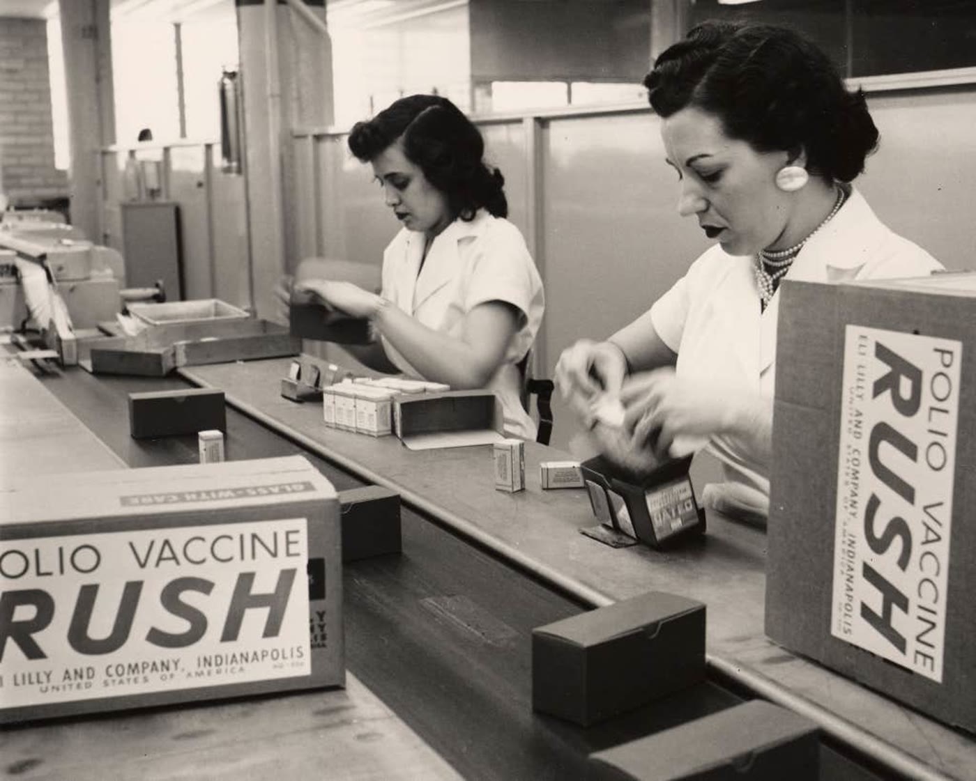 Lilly employees packing polio vaccines for shipment