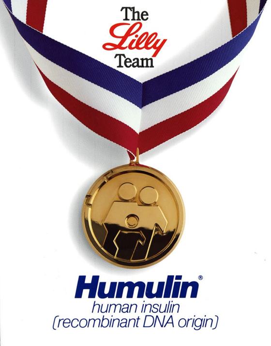 Humulin advertisement showing a gold medal on a ribbon labelled The Lilly Team.